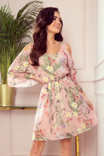 A light, chiffon dress with a floral pattern features a flattering V-neckline and stylish cold-shoulder sleeves. The dress is cinched at the waist with a matching tie, creating an elegant and breezy silhouette.}