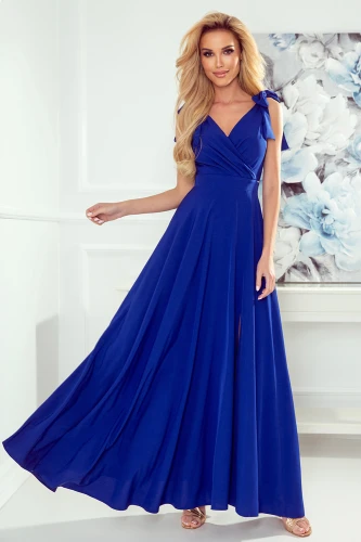 A long, elegant blue dress with a flowing skirt and a deep V-neckline, featuring delicate shoulder ties. The dress exudes sophistication, perfect for formal occasions or evening events.}