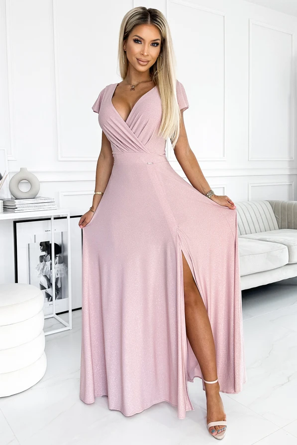 A shimmering, floor-length pink dress with a wrap-style bodice and a thigh-high slit, perfect for elegant occasions. The dress features short sleeves and a flattering V-neckline, adding a touch of sophistication.