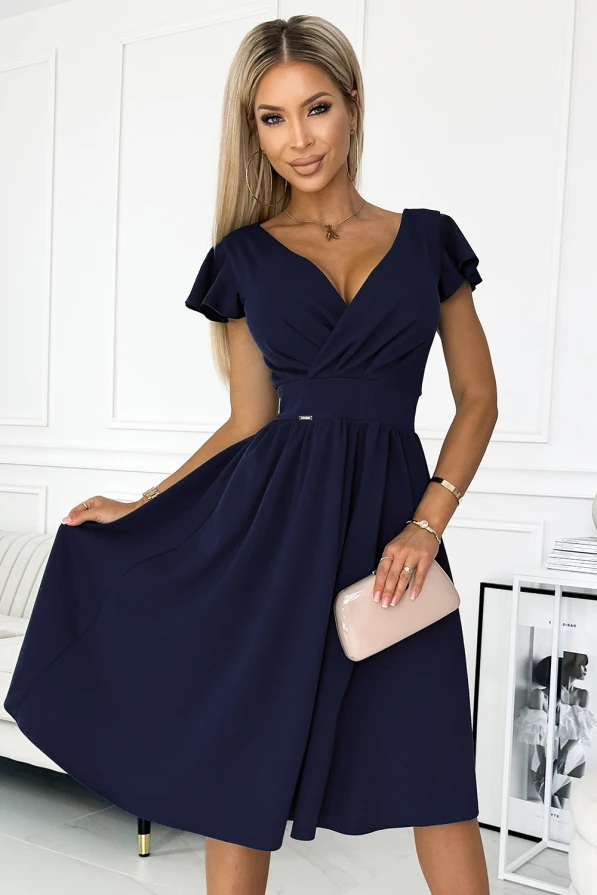 A navy blue dress with a flattering V-neckline and short flutter sleeves, featuring a fitted waist and a flowing A-line skirt. The elegant design is complemented by a subtle pleat detail, perfect for both casual and formal occasions.