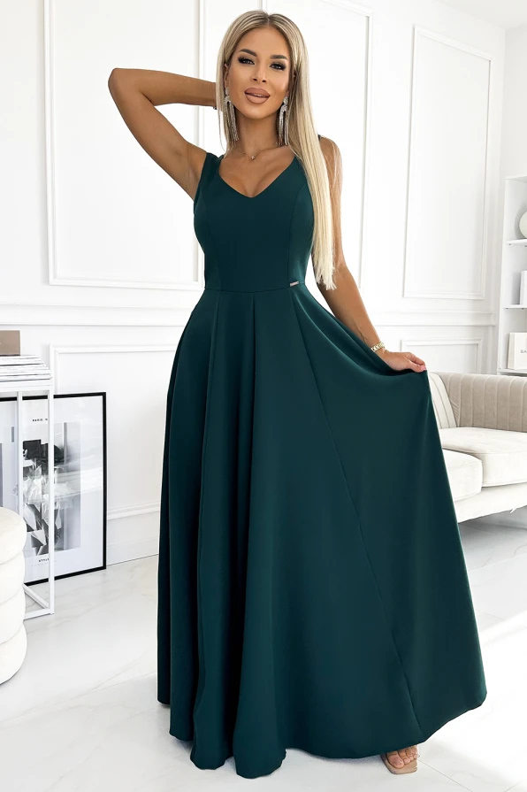 A long, elegant dark green dress with a fitted bodice and a flowing skirt, perfect for formal occasions. The dress features a sleeveless design with a V-neckline, adding a touch of sophistication.