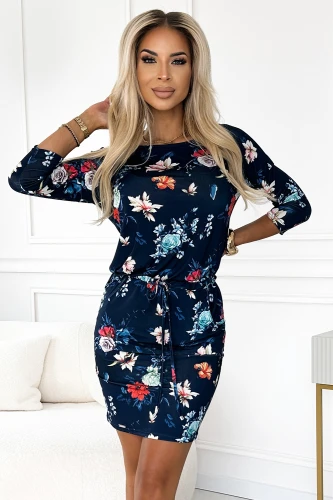 A navy blue floral dress with three-quarter sleeves and a drawstring waist, perfect for a casual yet stylish look. The vibrant flower pattern adds a touch of elegance and charm to the comfortable, sporty design.}
