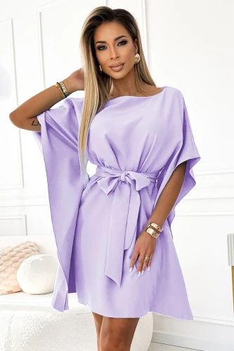 A stylish lavender dress with flowing sleeves and a matching waist tie, perfect for elegant occasions. The soft fabric and relaxed fit offer both comfort and sophistication.}