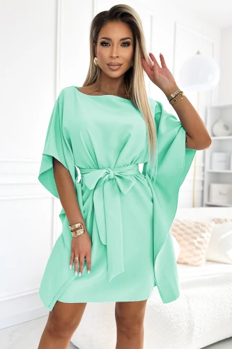 A stylish mint green dress with a loose, flowing silhouette features wide sleeves and a matching belt that cinches at the waist for a flattering fit. The soft fabric and elegant design make it perfect for both casual and formal occasions.}