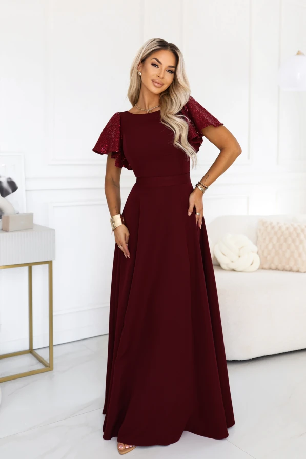 Burgundy long evening dress Mirella Numoco with sequin sleeves, a flared hem and an accentuated waist