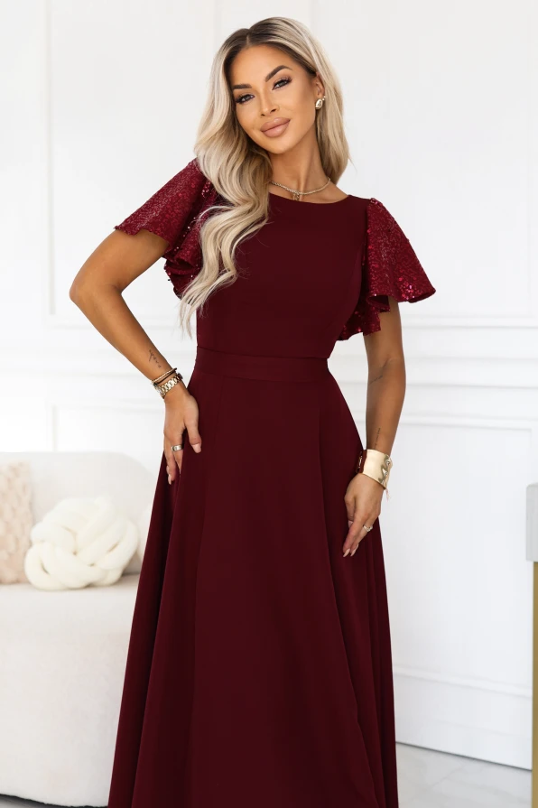 Burgundy long evening dress Mirella Numoco with sequin sleeves, a flared hem and an accentuated waist