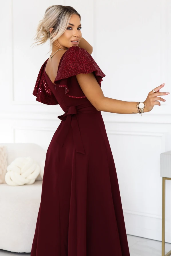 Burgundy long evening dress Mirella Numoco with sequin sleeves, a flared hem and an accentuated waist