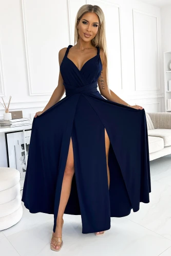 A long, elegant navy blue dress features a fitted bodice with a deep V-neckline and wide straps, complemented by a flowing skirt with high slits. The dress is perfect for formal occasions, offering a sophisticated and stylish look.}