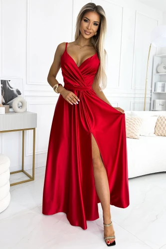 A long, elegant red dress with a deep V-neckline and a high slit, perfect for formal occasions. The dress features a fitted waist and flowing skirt, adding a touch of sophistication and glamour.}